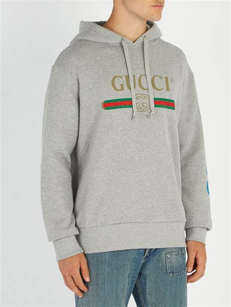 grey gucci sweatshirt.